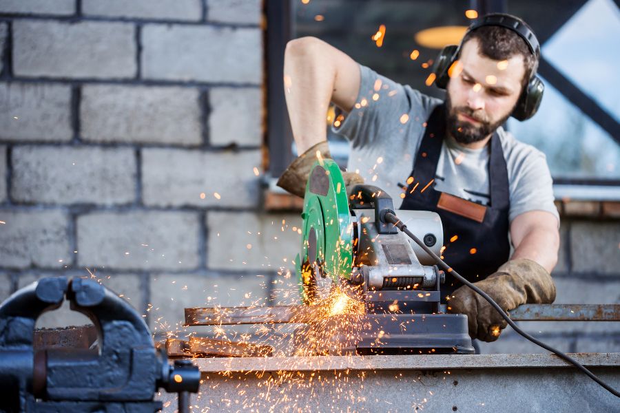 A man operating noisy machinery